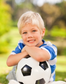 Elementary Boy Student Playing Soccer