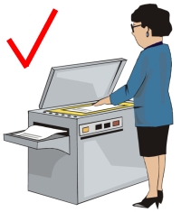 teacher at photocopy machine