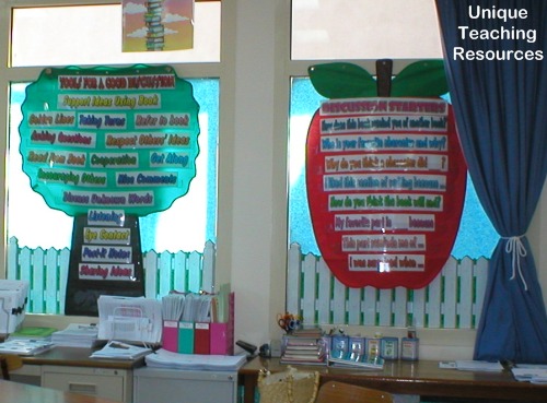 Discussion starters sentence strips inside tree and apple shaped pocket charts.