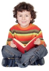 Cute Elementary School Boy Reading a Book