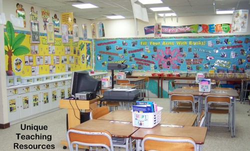 First day of school reading bulletin board displays:  Fill Your Arms With Books and Learn More About Roald Dahl.