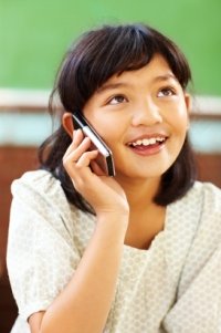 Elementary Girl Student Talking On Cell Phone