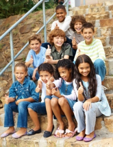 Happy Elementary School Students On Steps