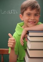 Thumbs Up Boy Elementary School Student Reading Books