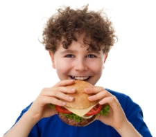 Boy Elementary School Student Eating Cheeseburger